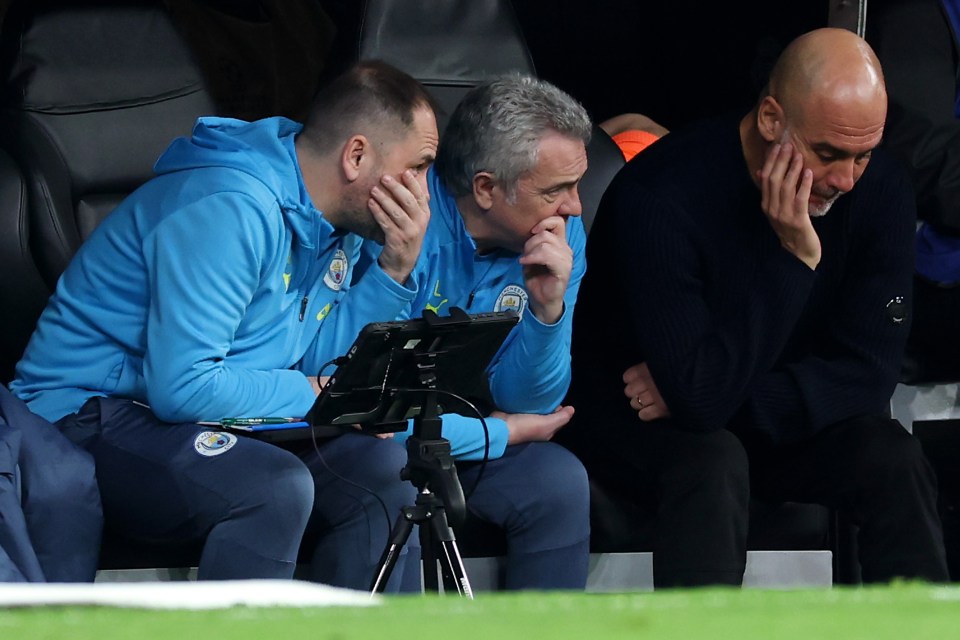 Manchester City coaching staff looking dejected.