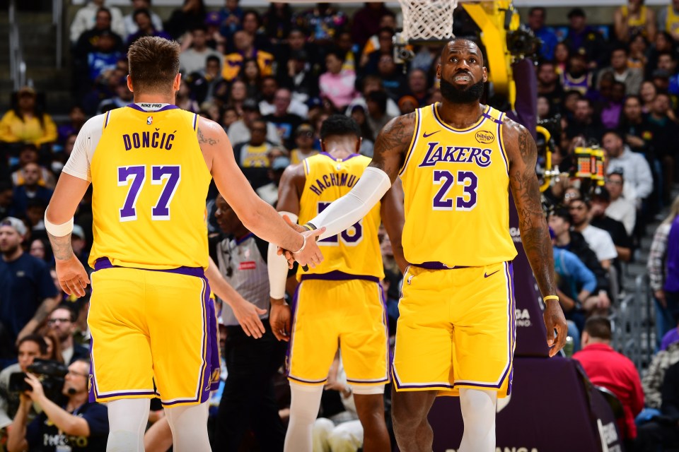 LeBron James and another Lakers player shaking hands after a game.