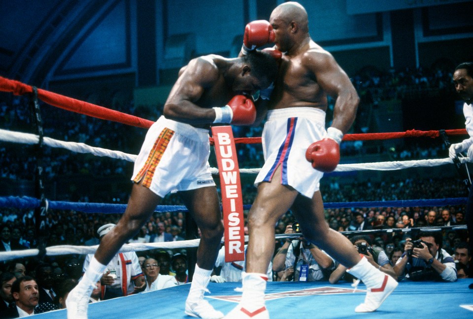 ATLANTIC CITY - APRIL 19: Evander Holyfield and George Foreman fight for the WBC, WBA and IBF heavyweight tittles on April 19, 1991 at the Convention Hall in Atlantic City, New Jersey. Holyfield won the fight with a 12 unanimous decision. (Photo by Focus on Sport/Getty Images)
