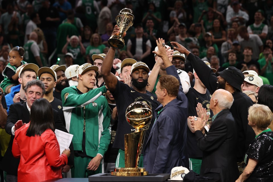 BOSTON, MA - JUNE 17: Jaylen Brown #7 of the Boston Celtics celebrates after receiving the Bill Russell Finals MVP Trophy against the Dallas Mavericks during Game 5 of the 2024 NBA Finals on June 17, 2024 at TD Garden in Boston, Massachusetts. NOTE TO USER: User expressly acknowledges and agrees that, by downloading and or using this photograph, User is consenting to the terms and conditions of the Getty Images License Agreement. Mandatory Copyright Notice: Copyright 2024 NBAE  (Photo by Joe Murphy/NBAE via Getty Images)