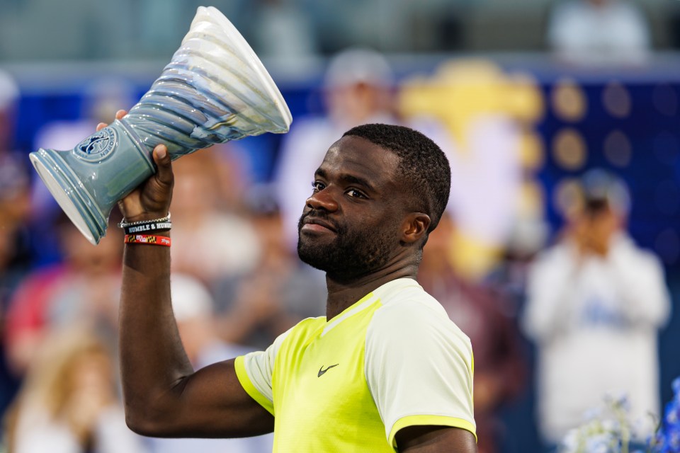 MASON, OHIO - AUGUST 19:  Frances Tiafoe of the United States   receives the runner-up trophy after losing Jannik Sinner of Italy in the final of the Cincinnati Open at the Lindner Family Tennis Center on August 19, 2024 in Mason, Ohio. (Photo by Frey/TPN/Getty Images)