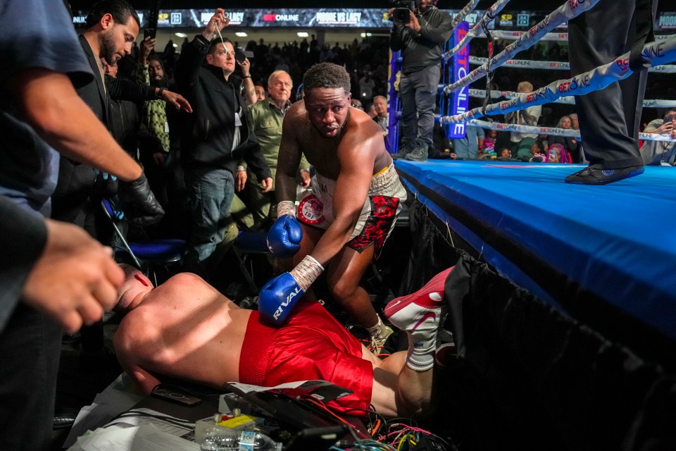 FLINT, MICHIGAN - FEBRUARY 02: Brandon Moore returns to the ring after Skylar Lacy fell on him out of the boxing ring, resulting in a disqualification for unsportsmanlike conduct on Lacy, during the eighth round of their USBA heavyweight vacant title bout on February 02, 2025 at Dort Financial Center in Flint, Michigan. (Photo by Nic Antaya/Getty Images)