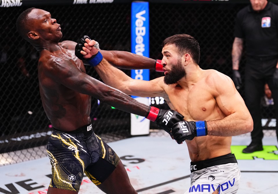 RIYADH, SAUDI ARABIA - FEBRUARY 01: (R-L) Nassourdine Imavov of Russia punches Israel Adesanya of Nigeria in a middleweight fight during the UFC Fight Night event at anb Arena on February 01, 2025 in Riyadh, Saudi Arabia.  (Photo by Chris Unger/Zuffa LLC)