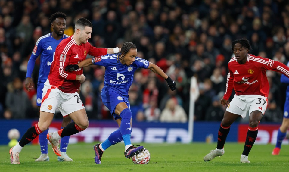 MANCHESTER, ENGLAND - FEBRUARY 7: Diogo Dalot of Manchester United and Bobby Decordova-Reid of Leicester City challenge during the Emirates FA Cup Fourth Round match between Manchester United and Leicester City at Old Trafford on February 7, 2025 in Manchester, England. (Photo by Richard Sellers/Sportsphoto/Allstar via Getty Images)