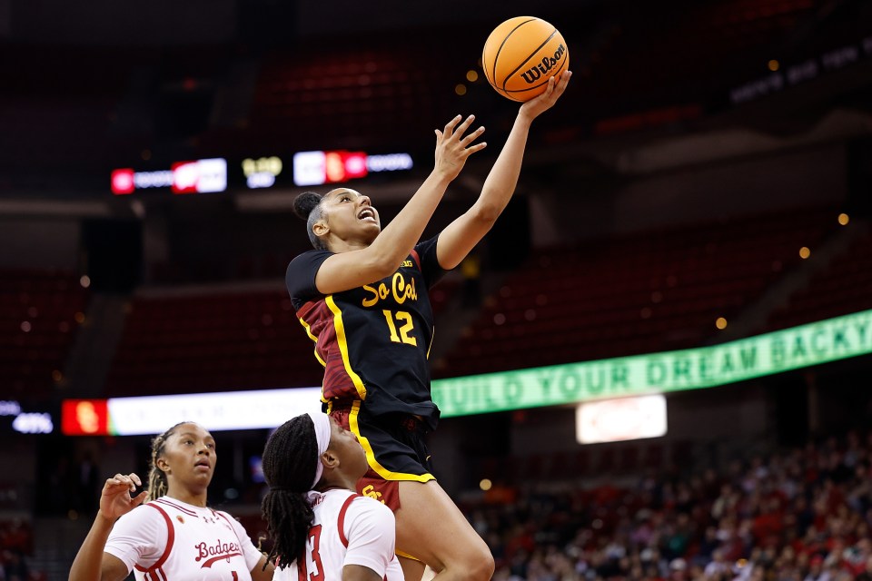 MADISON, WISCONSIN - FEBRUARY 05: JuJu Watkins #12 of the USC Trojans drives to the basket during the first half of the game against the Wisconsin Badgers at Kohl Center on February 05, 2025 in Madison, Wisconsin. (Photo by John Fisher/Getty Images)