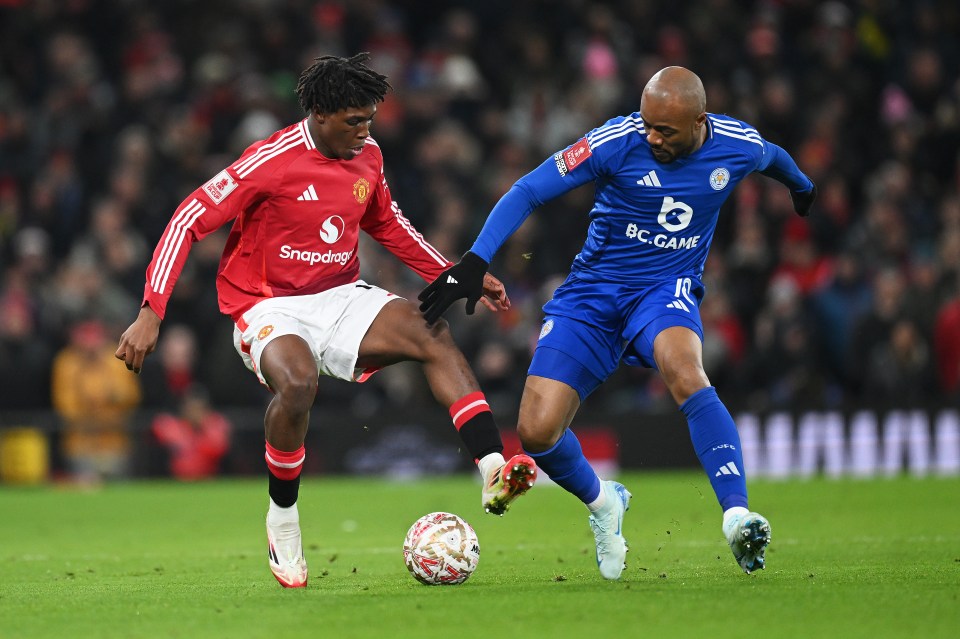 MANCHESTER, ENGLAND - FEBRUARY 07: Patrick Dorgu of Manchester United is challenged by Jordan Ayew of Leicester City during the Emirates FA Cup Fourth Round match between Manchester United and Leicester City at Old Trafford on February 07, 2025 in Manchester, England. (Photo by Michael Regan/Getty Images)