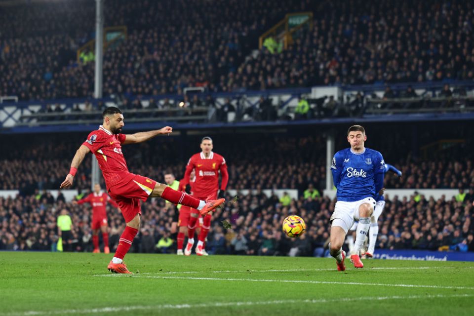 LIVERPOOL, ENGLAND - FEBRUARY 12: Mohamed Salah of Liverpool scores a goal to make it 1-2  during the Premier League match between Everton FC and Liverpool FC at Goodison Park on February 12, 2025 in Liverpool, England. (Photo by Robbie Jay Barratt - AMA/Getty Images)