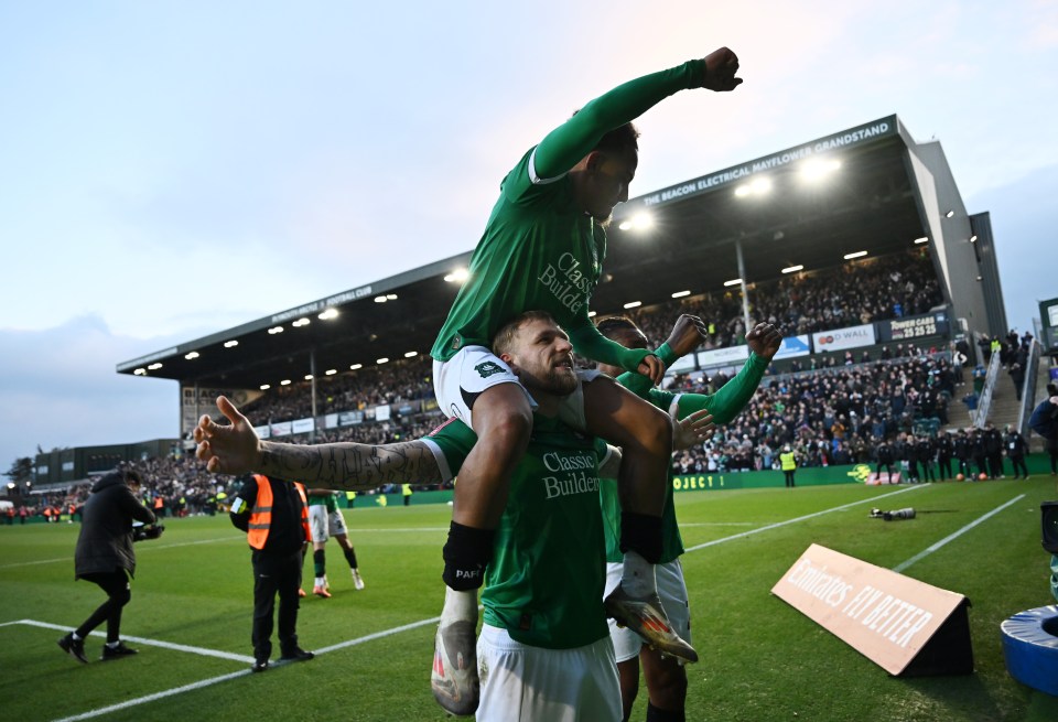 PLYMOUTH, ENGLAND - FEBRUARY 09: Lewis Gibson, Matthew Sorinola and Muhamed Tijani of Plymouth Argyle celebrate victory after the Emirates FA Cup Fourth Round match between Plymouth Argyle and Liverpool at Home Park on February 09, 2025 in Plymouth, England. (Photo by Dan Mullan/Getty Images)