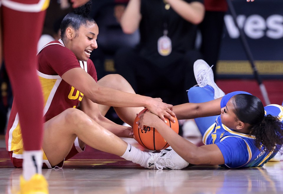 Los Angeles, California February 13, 2025-USC's JuJu Watkins and UCLA's Londynn Jones battle for a loose ball in the second quarter at the Galen Center Thursday. (Wally Skalij/Los Angeles Times via Getty Images)