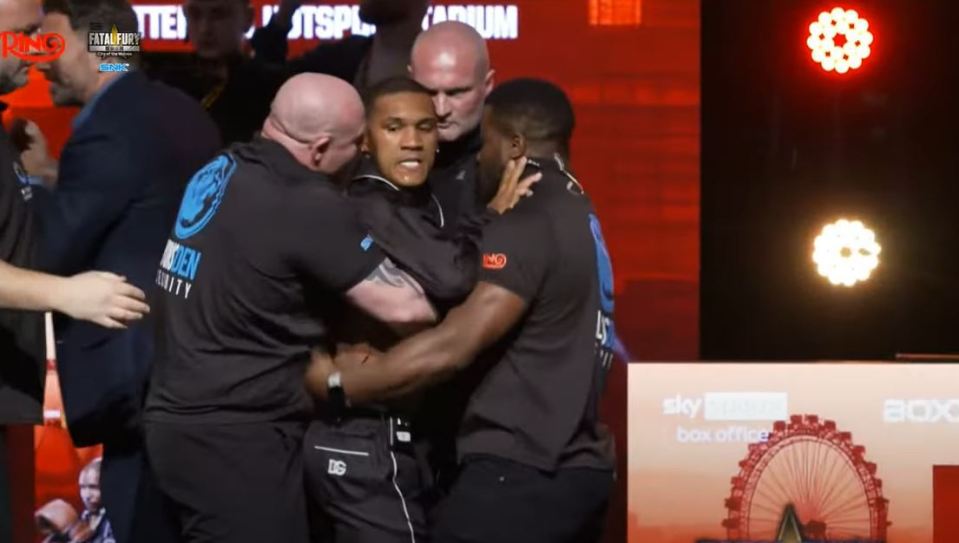 A furious Benn had to be restrained by multiple security guards