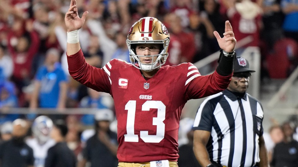 Brock Purdy #13 of the San Francisco 49ers celebrates a touchdown.