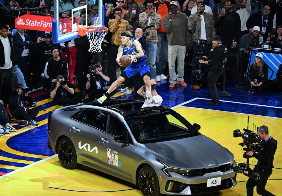Mac McClung dunking over a car during the NBA Slam Dunk Contest.