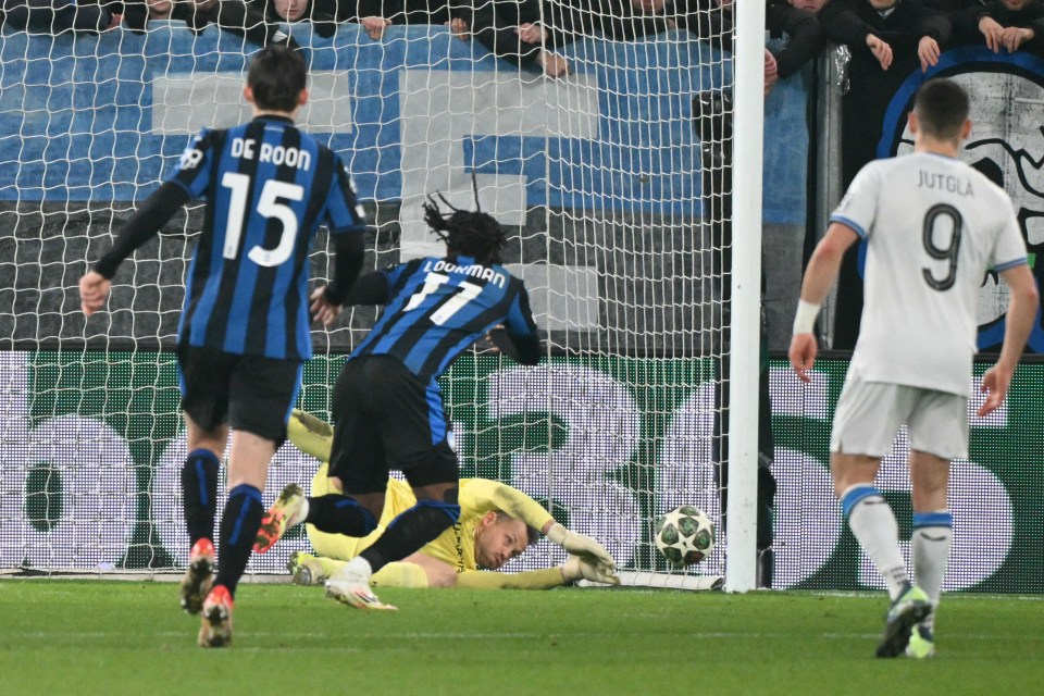Goalkeeper diving to stop a penalty shot.