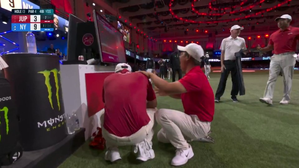 Golfer consoled by teammate after a golf match.