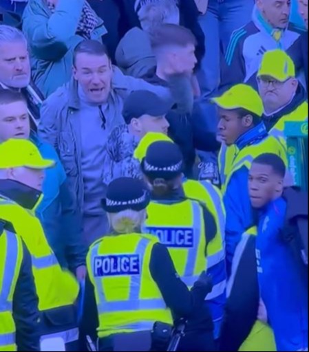 Celtic fans had to be held back from the Rangers dugout by police