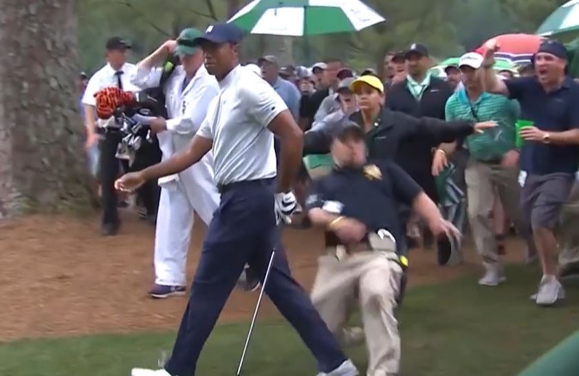 A security guard slipped after rushing to keep the crowd back after his approach shot