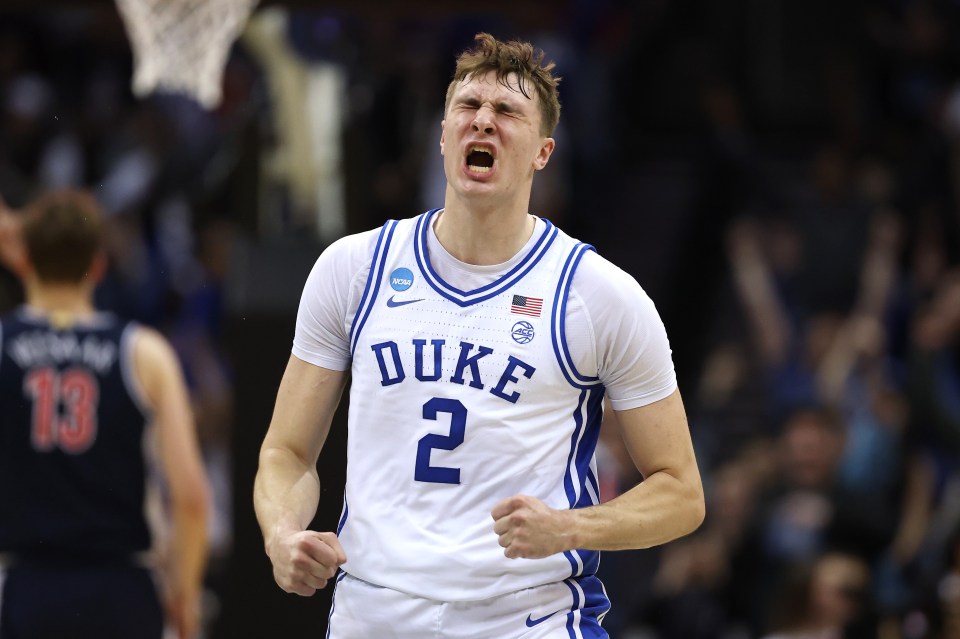 NEWARK, NEW JERSEY - MARCH 27: Cooper Flagg #2 of the Duke Blue Devils reacts after scoring a three point basket to end the first half against the Arizona Wildcats in the East Regional Sweet Sixteen round of the NCAA Men's Basketball Tournament at Prudential Center on March 27, 2025 in Newark, New Jersey. (Photo by Patrick Smith/Getty Images)