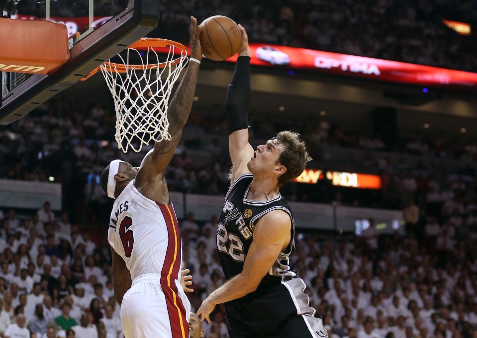 MIAMI, FL - JUNE 09:  LeBron James #6 of the Miami Heat blocks the shot of Tiago Splitter #22 of the San Antonio Spurs in the fourth quarter during Game Two of the 2013 NBA Finals at AmericanAirlines Arena on June 9, 2013 in Miami, Florida. NOTE TO USER: User expressly acknowledges and agrees that, by downloading and or using this photograph, User is consenting to the terms and conditions of the Getty Images License Agreement.  (Photo by Christian Petersen/Getty Images)