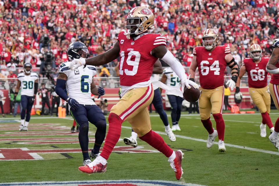 SANTA CLARA, CALIFORNIA - DECEMBER 10: Deebo Samuel #19 of the San Francisco 49ers scores a touchdown during the third quarter in the game against the Seattle Seahawks at Levi's Stadium on December 10, 2023 in Santa Clara, California. (Photo by Thearon W. Henderson/Getty Images)