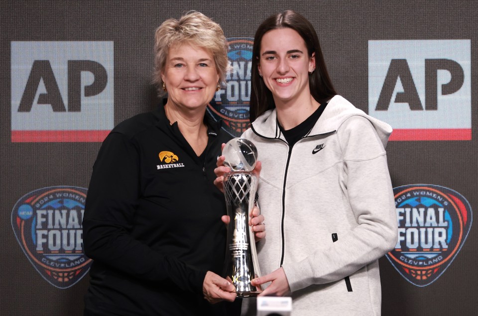 CLEVELAND, OHIO - APRIL 04: AP Player of the Year Caitlin Clark #22 of the Iowa Hawkeyes poses with her award and head coach Lisa Bluder during a press conference ahead of the 2024 NCAA Women's Basketball Tournament Final Four at Rocket Mortgage Fieldhouse on April 04, 2024 in Cleveland, Ohio. (Photo by Gregory Shamus/Getty Images)