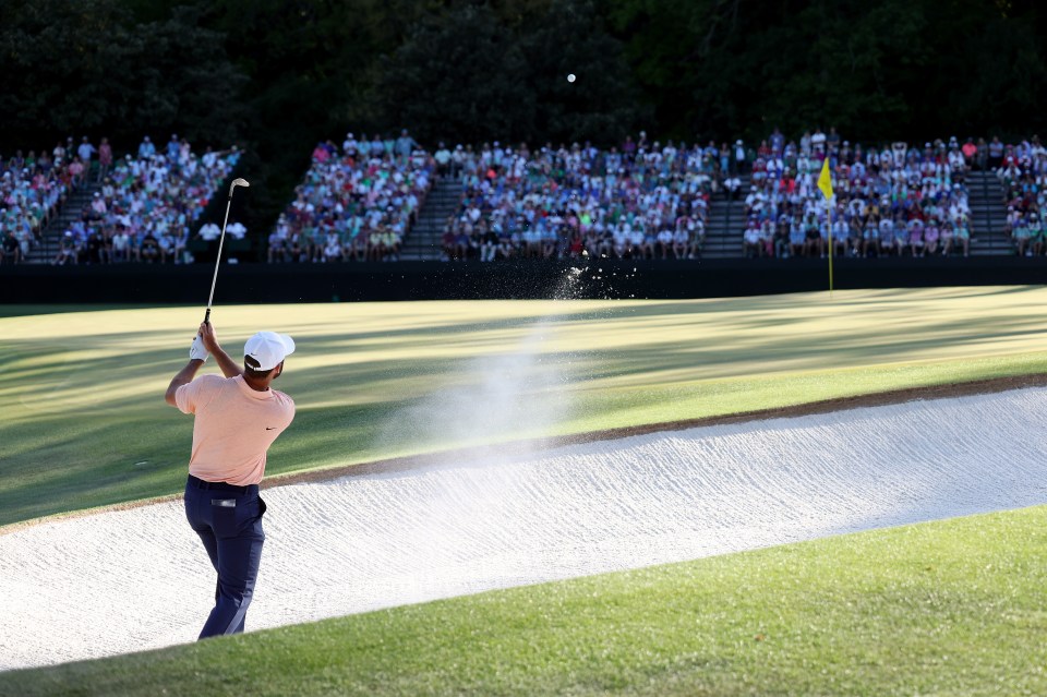 AUGUSTA, GEORGIA - APRIL 14: Scottie Scheffler of the United States plays his shot from the bunker on the 15th hole during the final round of the 2024 Masters Tournament at Augusta National Golf Club on April 14, 2024 in Augusta, Georgia. (Photo by Jamie Squire/Getty Images)