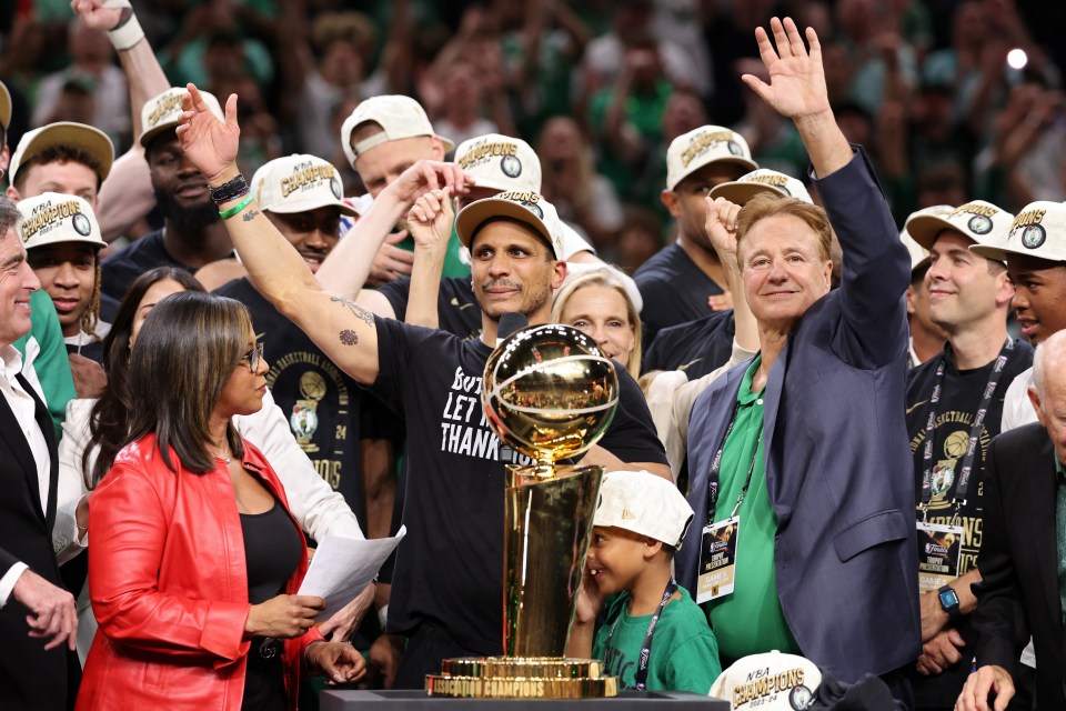 BOSTON, MASSACHUSETTS - JUNE 17: Head coach Joe Mazzulla of the Boston Celtics celebrates in front of the Larry O’Brien Championship Trophy after Boston's 106-88 win against the Dallas Mavericks in Game Five of the 2024 NBA Finals at TD Garden on June 17, 2024 in Boston, Massachusetts. NOTE TO USER: User expressly acknowledges and agrees that, by downloading and or using this photograph, User is consenting to the terms and conditions of the Getty Images License Agreement. (Photo by Elsa/Getty Images)