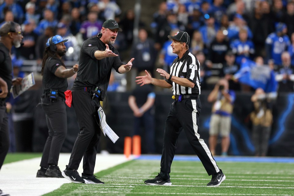 DETROIT,MICHIGAN-JANUARY 5:  Head coach Dan Campbell of the Detroit Lions interacts with down judge Kent Payne (79) during a game between the Detroit Lions and the Minnesota Vikings in Detroit, Michigan USA, on Sunday, January 5, 2025. (Photo by Amy Lemus/NurPhoto via Getty Images)