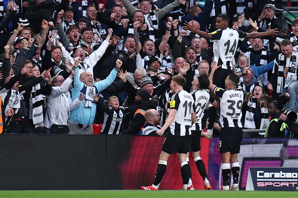 Newcastle United's Swedish striker #14 Alexander Isak (R) celebrates in front of the Newcastle fans after scoring their second goal during the English League Cup final football match between Liverpool and Newcastle United at Wembley Stadium, north-west London on March 16, 2025. (Photo by HENRY NICHOLLS / AFP) / RESTRICTED TO EDITORIAL USE. No use with unauthorized audio, video, data, fixture lists, club/league logos or 'live' services. Online in-match use limited to 120 images. An additional 40 images may be used in extra time. No video emulation. Social media in-match use limited to 120 images. An additional 40 images may be used in extra time. No use in betting publications, games or single club/league/player publications. /  (Photo by HENRY NICHOLLS/AFP via Getty Images)