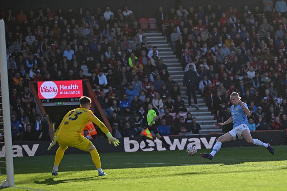 Manchester City's Norwegian striker #09 Erling Haaland (R) scores their first goal during the English FA Cup quarter-final football match between Bournemouth and Manchester City at the Vitality Stadium in Bournemouth, on the south coast of England on March 30, 2025. (Photo by JUSTIN TALLIS / AFP) / RESTRICTED TO EDITORIAL USE. No use with unauthorized audio, video, data, fixture lists, club/league logos or 'live' services. Online in-match use limited to 120 images. An additional 40 images may be used in extra time. No video emulation. Social media in-match use limited to 120 images. An additional 40 images may be used in extra time. No use in betting publications, games or single club/league/player publications. /  (Photo by JUSTIN TALLIS/AFP via Getty Images)
