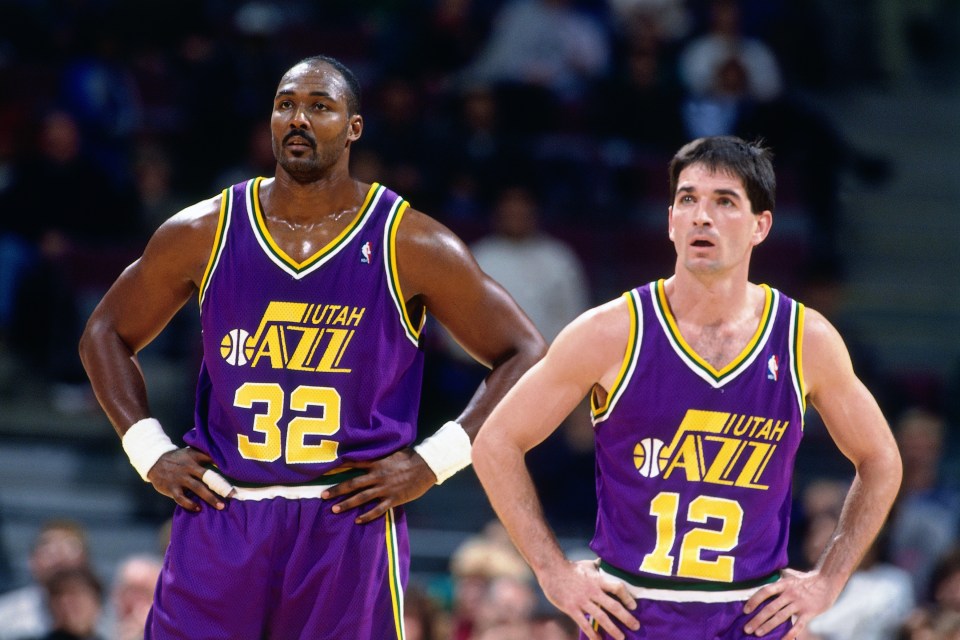 AUBURN HILLS, MI - NOVEMBER 17: Karl Malone #32 and John Stockton #12 of the Utah Jazz look on  during a game played on November 17, 1995 at the Palace of Auburn Hills in Auburn Hills, Michigan. NOTE TO USER: User expressly acknowledges and agrees that, by downloading and/or using this photograph, user is consenting to the terms and conditions of the Getty Images License Agreement.  Mandatory Copyright Notice: Copyright 1995 NBAE (Photo by Nathaniel S. Butler/NBAE via Getty Images)