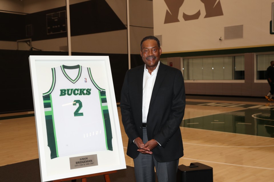 MILWAUKEE, WI - SEPTEMBER 26: Milwaukee Bucks co-owner Junior Bridgeman poses for a photo with his jersey during a press conference on September 26, 2024 at the Froedtert & Medical Science of Wisconsin Sports Science Center in Milwaukee, Wisconsin. NOTE TO USER: User expressly acknowledges and agrees that, by downloading and or using this Photograph, user is consenting to the terms and conditions of the Getty Images License Agreement. Mandatory Copyright Notice: Copyright 2024 NBAE (Photo by Gary Dineen/NBAE via Getty Images)