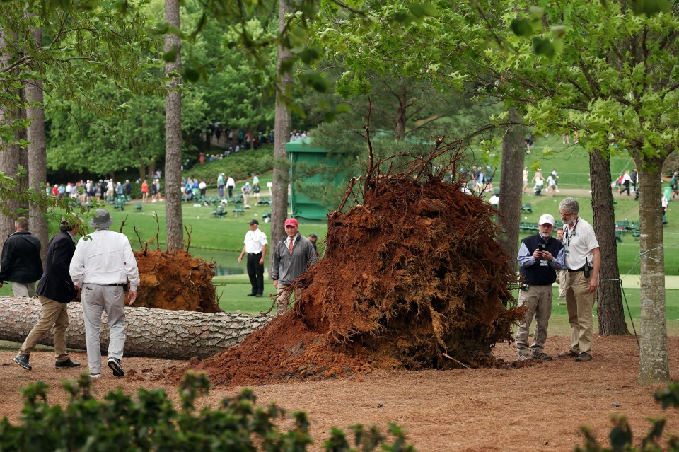 AUGUSTA, GEORGIA - APRIL 07: Course officials look over fallen trees on the 17th hole during the second round of the 2023 Masters Tournament at Augusta National Golf Club on April 07, 2023 in Augusta, Georgia. (Photo by Patrick Smith/Getty Images)
