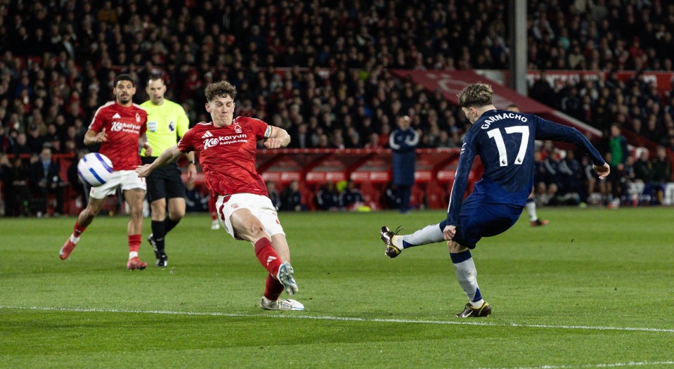 NOTTINGHAM, ENGLAND - APRIL 1: Manchester United's Alejandro Garnacho  shoots at goal under pressure from Nottingham Forest's Ryan Yates during the Premier League match between Nottingham Forest FC and Manchester United FC at City Ground on April 1, 2025 in Nottingham, England. (Photo by Andrew Kearns - CameraSport via Getty Images)