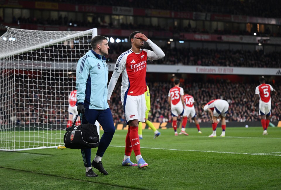LONDON, ENGLAND - APRIL 01: Gabriel of Arsenal looks dejected as he leaves the pitch with a member of the medical team after picking up an injury during the Premier League match between Arsenal FC and Fulham FC at Emirates Stadium on April 01, 2025 in London, England. (Photo by Shaun Botterill/Getty Images)
