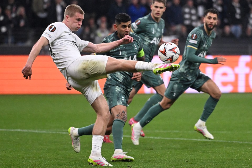 Frankfurt's Danish defender #13 Rasmus Kristensen (L) and Tottenham Hotspur's Argentinian defender #17 Cristian Romero vie for the ball during the UEFA Europa League quarter-final second leg football match between Eintracht Frankfurt and Tottenham Hotspur in Frankfurt am Main, western Germany on April 17, 2025. (Photo by Kirill KUDRYAVTSEV / AFP) (Photo by KIRILL KUDRYAVTSEV/AFP via Getty Images)