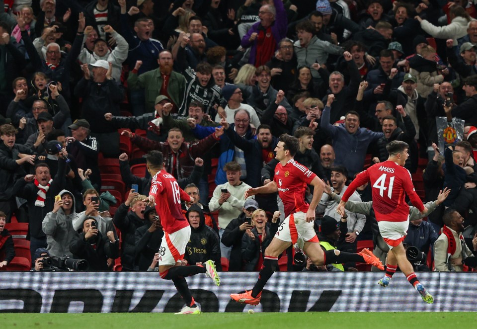 MANCHESTER, ENGLAND - APRIL 17: Manchester United's Harry Maguire celebrates scoring his side's fifth goal with Casemiro and Harry Amass during the UEFA Europa League 2024/25 Quarter Final Second Leg match between Manchester United and Olympique Lyonnais at Old Trafford on April 17, 2025 in Manchester, England. (Photo by Alex Dodd - CameraSport via Getty Images)