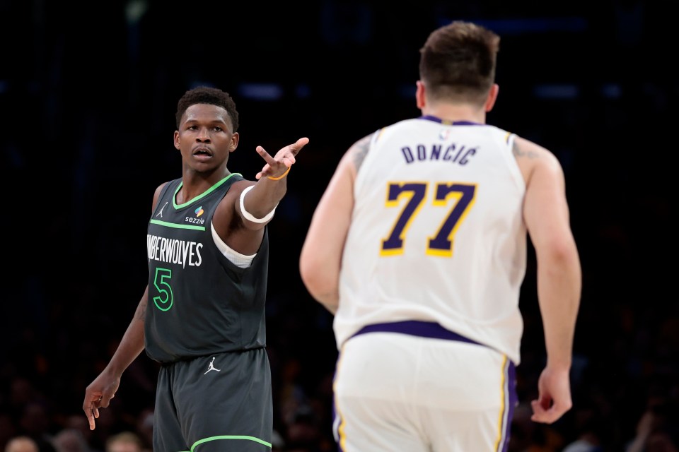 LOS ANGELES, CALIFORNIA - APRIL 19: Anthony Edwards #5 of the Minnesota Timberwolves reacts in front of Luka Doncic #77 of the Los Angeles Lakers during the fourth quarter in Game One of the Western Conference First Round NBA Playoffs at Crypto.com Arena on April 19, 2025 in Los Angeles, California. NOTE TO USER: User expressly acknowledges and agrees that, by downloading and or using this photograph, User is consenting to the terms and conditions of the Getty Images License Agreement. (Photo by Ronald Martinez/Getty Images)