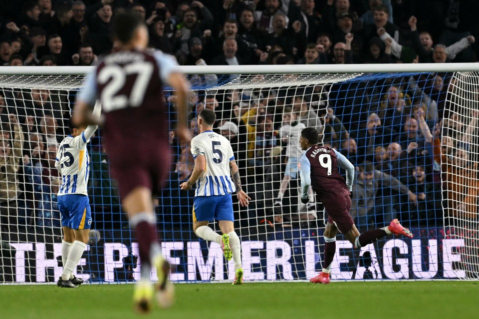 Rashford wheels away to celebrate after putting Villa in front...