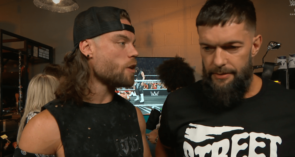 Dom could be seen peering down at a beaten Triple H in the video game