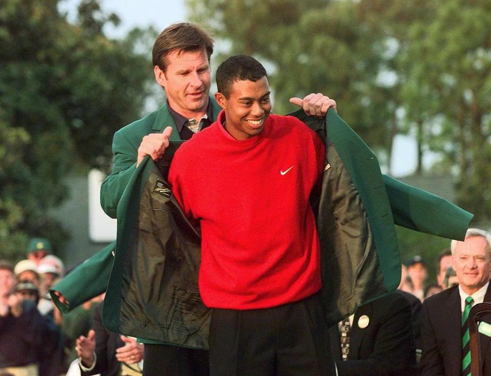 Faldo helped Tiger Woods put on the famous green Masters jacket in 1997