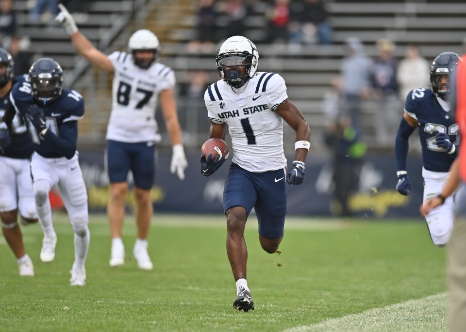 EAST HARTFORD, CT - SEPTEMBER 30: Utah State Aggies wide receiver Jalen Royals (1) carries the ball down the sidelines during the game as the Utah State Aggies take on the UConn Huskies on September 30, 2023, at the Rentschler Field in East Hartford, Connecticut. (Photo by Williams Paul/Icon Sportswire via Getty Images)