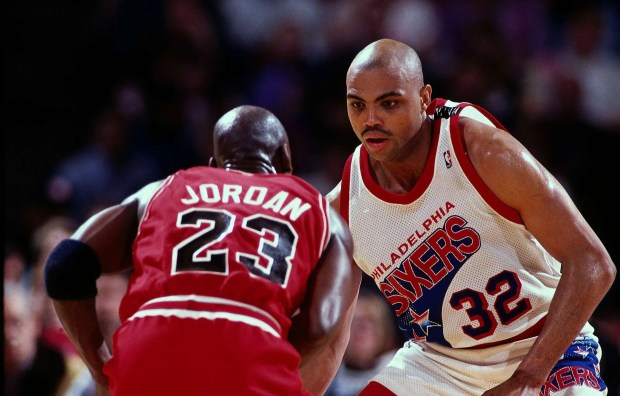 Charles Barkley defending Michael Jordan during an NBA game.